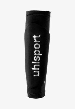 Zwarte sportscheenbeschermer van rekbaar materiaal, met een opvallend wit "uhlsport" logo, gestroomlijnde vorm en elastische bovenrand.