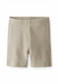 Shorts côtelés beiges avec une coupe ajustée et une taille élastique. Le tissu présente une texture subtile avec des coutures soignées le long des bords.