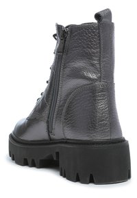 Gray leather ankle boot with a textured finish, lace-up front, side zipper, and chunky black sole featuring deep treads.