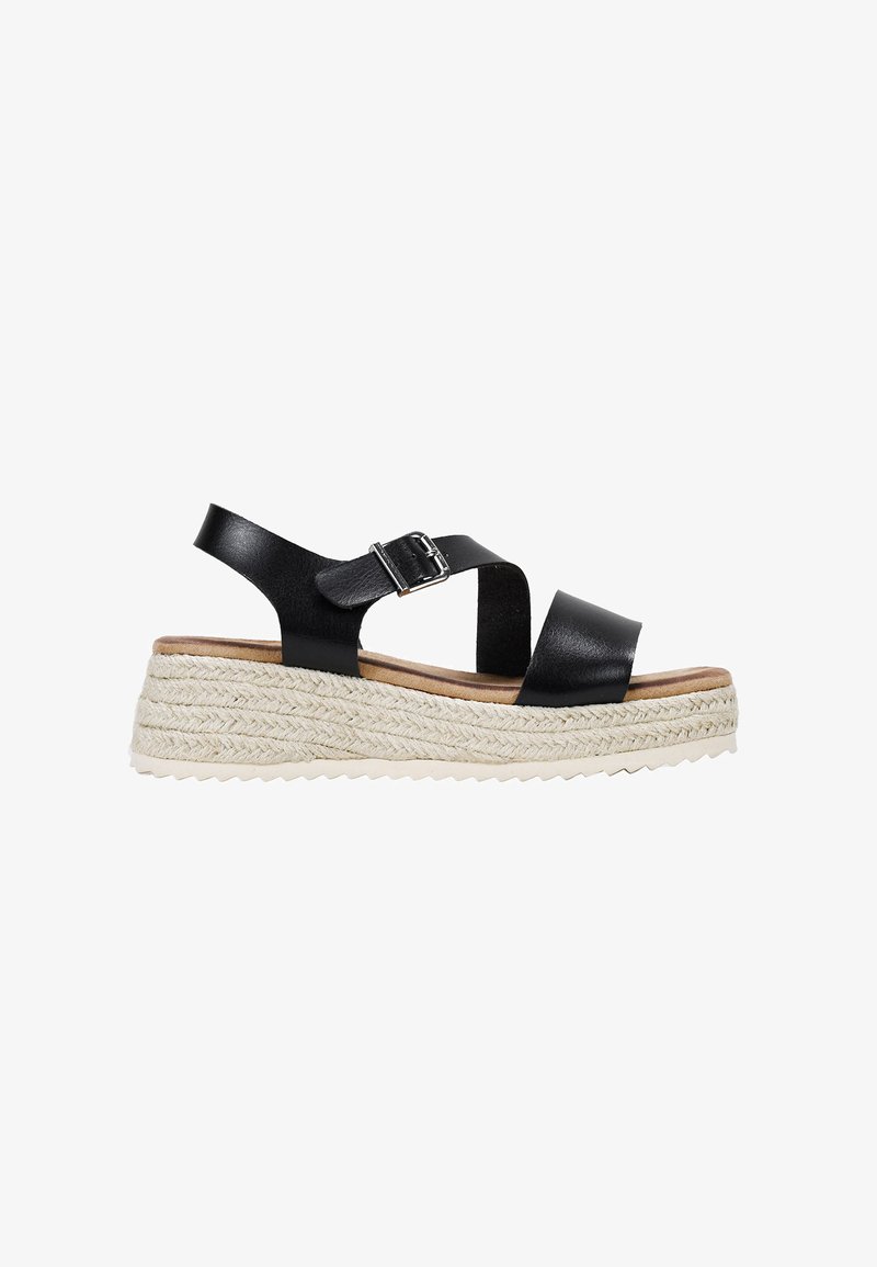 Black leather wedge sandal with two cross straps, adjustable ankle buckle, and braided jute platform. Textured sole for grip.