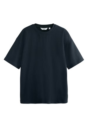 T-shirt noir à manches courtes en coton. Il présente un col rond côtelé et une coupe ample et décontractée avec un ourlet droit.