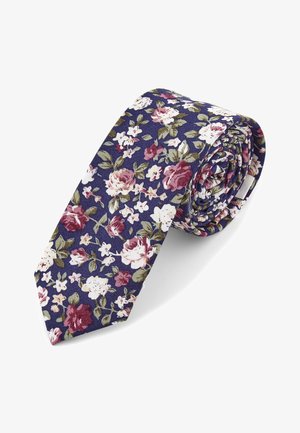 Blomster slips med marineblå bakgrunn, rosa og hvite blomster samt grønne blader. Laget av stoff, rullet med spiss ende synlig.