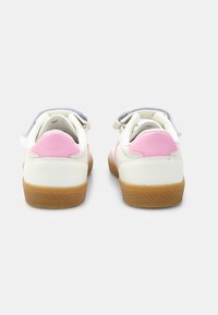 White leather sneakers with pink accents and a gum rubber sole, featuring a soft blue collar and adjustable strap closure.