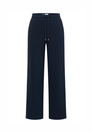 Marineblauwe sweatpants met brede pijpen van een zachte stof, met een elastische tailleband met een trekkoord en metalen aglets. Geen zichtbare zakken.