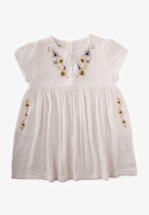 White, cotton dress featuring short sleeves, a round neckline, pleated bodice, and floral embroidery in yellow, blue, and black accents.