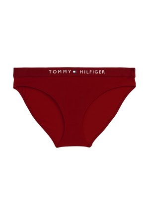 Rode katoen bikini slipjes met een effen ontwerp en een merkband met "TOMMY HILFIGER" in witte tekst. Glad textuur.