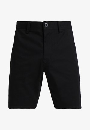 Pantalones cortos de algodón negros con corte recto, cierre frontal con botón y un único acento de metal. Textura suave, sin patrones visibles.