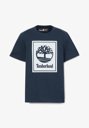 Marineblå bomuld T-shirt med et hvidt grafisk trælogo og "Timberland" tekst i fed sort, rund halsudskæring, kortærmet.