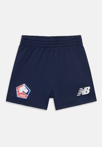 Tengerészkék atlétikai rövidnadrág, lélegző anyagból készült, rugalmas derékpánttal, logóval ellátott folttal és fehér "NB" márkajelzéssel az oldalon.