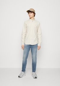 SCOTCH & SODA Jeans in Lichtgrijs ABOUT YOU