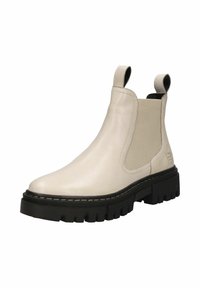 Beige leather Chelsea boot with elastic side panels and pull tabs. Thick black rubber sole with a rugged tread. Subtle stitching detail.