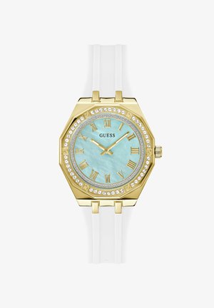 Gold octagonal watch with a light blue dial, Roman numerals, rhinestone accents, and a white silicone strap.
