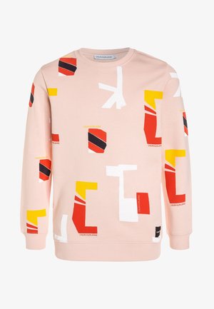 Sweat-shirt rose clair avec des formes géométriques abstraites rouges, jaunes, blanches et noires et texte « Calvin Klein Jeans » dispersé.