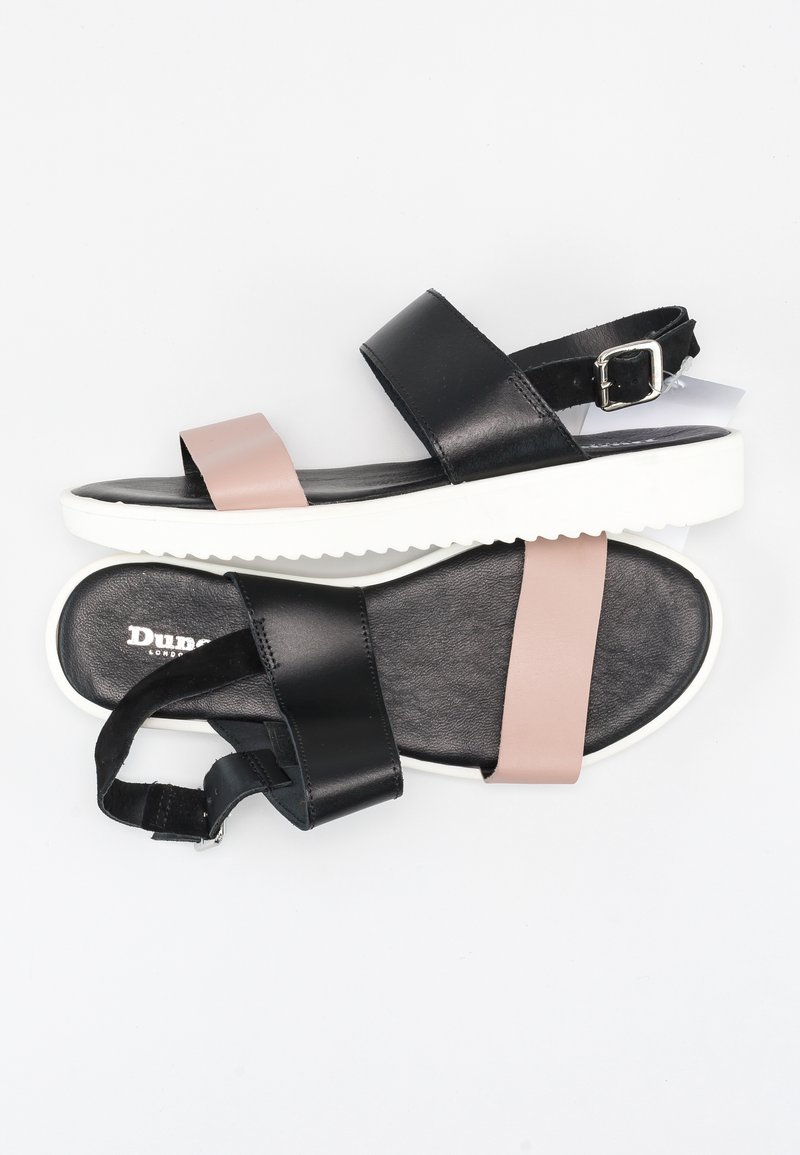 Sandales en cuir noires et roses avec une sangle de cheville réglable, semelle en caoutchouc blanche et semelle intérieure texturée. Comprend deux larges sangles.