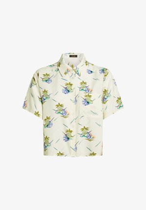 Koszula z krótkim rękawem zapinana na guziki, wykonana z lekkiego materiału, z jasnobeżowym tłem i tropikalnym wzorem z ananasów i muszli.