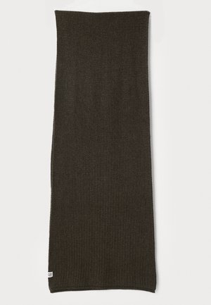 Ribbed dark green knit scarf with a smooth texture, elongated rectangular shape, and a small logo tag sewn at one corner.