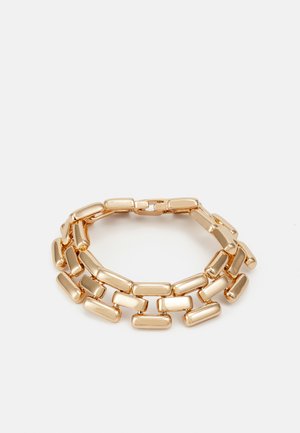 Gold link bracelet featuring rectangular and oval-shaped links with a polished finish, designed for a flexible fit.