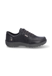 Zapatos casuales de cuero negro con punta redonda, suela de goma texturizada y cordones elásticos. Presentan un pequeño detalle metálico en el costado.