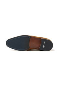 Brown suede shoe sole featuring a sleek design, contrasting blue stitching, and a dark rubber heel with embossed branding.