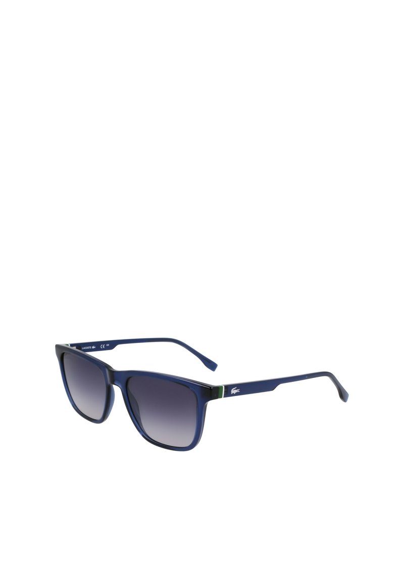 Navy rectangular sunglasses with gradient dark lenses, matte finish, and green accent on temples. Lacoste logo displayed on the side.