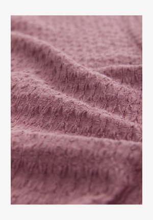 Textured, mauve fabric with a soft, slightly raised pattern, showcasing a crinkled surface with fine lines throughout.