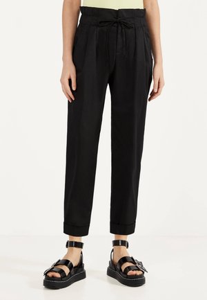 Spodnie materiałowe