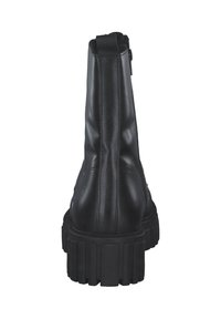 Stivale da combattimento in pelle nera con suola in gomma spessa, cuciture visibili, linguetta sul retro e cerniera laterale, visto dal tallone.