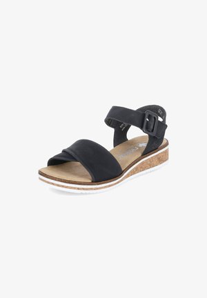 Black sandal with wide cross strap made of soft material, cork wedge sole, adjustable ankle strap with buckle, textured footbed.