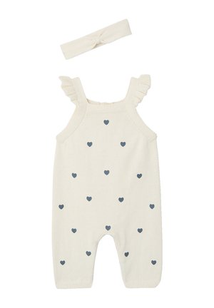 Babystrampler in Cremefarbe aus Strick mit Rüschen-Trägern und verstreuten kleinen grauen Herzmustern, dazu ein passendes Stirnband.