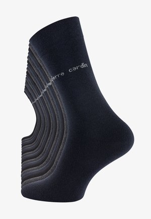 Neun Paare dunkelblauer Socken aus einem weichen, dehnbaren Material, mit einem gerippten Design und einem weißen Markenlogo an der Seite.