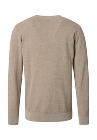 Beige tröja med en strukturerad stickad mönster, långa ärmar, rund halsringning samt ribbade manschetter och fåll. Baksidan är enkel utan några grafiska detaljer.