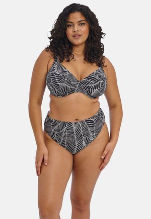 Black and white bikini featuring a leaf pattern. The top has a V-shaped design with wide straps, and the bottom is high-waisted.