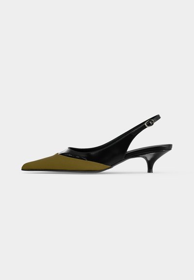 Pointed-toe slingback kitten heel shoe in black patent and olive leather with small buckle strap and low heel.
