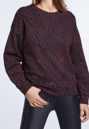 Sweat-shirt noir et bordeaux avec un motif à rayures zèbres, doté d'un col rond, de manches longues et de poignets côtelés. Texture du tissu lisse.