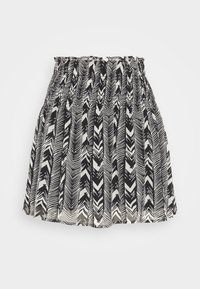 Jupe noire et blanche avec une taille froncée et un motif zigzag vertical. Fabriquée en tissu léger avec un design fluide.