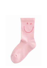 Rosa gerippte Socke mit einem lächelnden Gesichtdesign auf der Vorderseite, mit einer weichen Textur und einer abgerundeten Spitze.