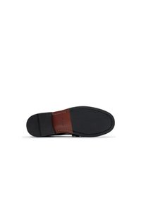 Suela de zapato de cuero negro con una parte inferior de goma texturizada. Sección media de cuero marrón con costuras blancas. Superficie lisa, forma contorneada.