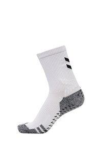 Hvid sportssok med ribbet design, sorte accentstriber og en tekstureret sort hæl. Har polstring og svangstøtte.