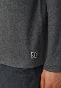 Gray sweater made of soft, textured fabric. Features a small "s.O" logo on the hem. The design includes a round neck and long sleeves.