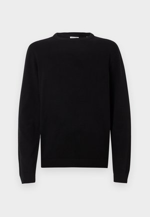 Mustan kudumi sokk, millel on ümar kaelus, pikad varrukad ning soonikuga mansetid ja äär. Sile tekstuur ja minimalistlik disain.