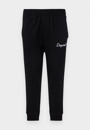 Pantalon de survêtement noir fuselé avec taille et chevilles élastiquées, ornée du logo blanc "Dsquared²" sur la cuisse droite supérieure.