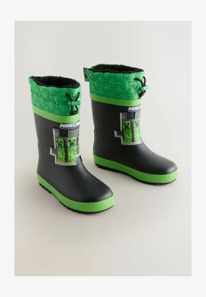 Fekete gumizátony esőcsizmák zöld textúrájú felével, Minecraft Creeper grafikával és zöld részletekkel a talpnál és a szárnál.