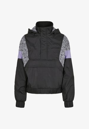 Svart vindjakke med zebra print på sidesømmene, lavendel detaljer, høy krage og elastiske mansjetter. Lett og sporty design.