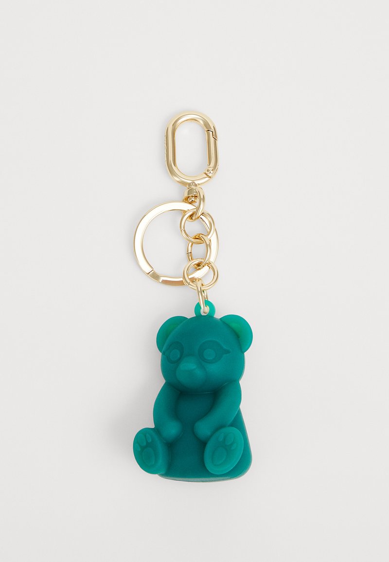 Teal silicone bear keychain with gold-tone metal hardware, linked to a round keyring, featuring a seated posture and rounded details.