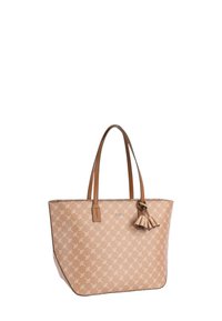 Sac fourre-tout tan avec un motif de feuilles, deux poignées marron, et un détail de pompon sur un côté. Fabriqué dans un matériau durable avec une forme structurée.