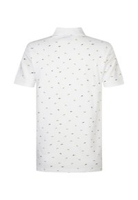 Bílá polo tričko s krátkým rukávem, s rozptýleným vzorem malých zelených a černých tvarů. Klasický design límce.