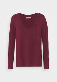 Burgunderfarbener Langarm-V-Ausschnitt-Oberteil aus weichem Baumwollstoff, mit einem lässigen Schnitt und einem schlichten Design ohne Muster oder Verzierungen.