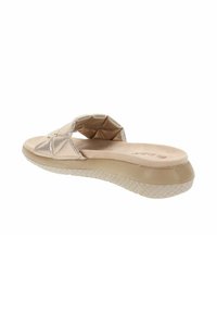 Sandale à enfiler avec une tige synthétique beige dotée d'accents texturés. Semelle intérieure rembourrée et semelle extérieure en caoutchouc à motifs pour une bonne adhérence.