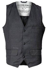 Šedá kostkovaná vesta z texturované tkaniny s výstřihem do V, předními kapsami a zapínáním na knoflíky. Uvnitř štítek s informacemi o značce.