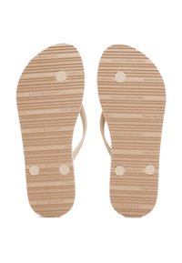 Sandals with a tan rubber sole, featuring textured stripes and circular accents, are labeled 'L' and 'R' for left and right.